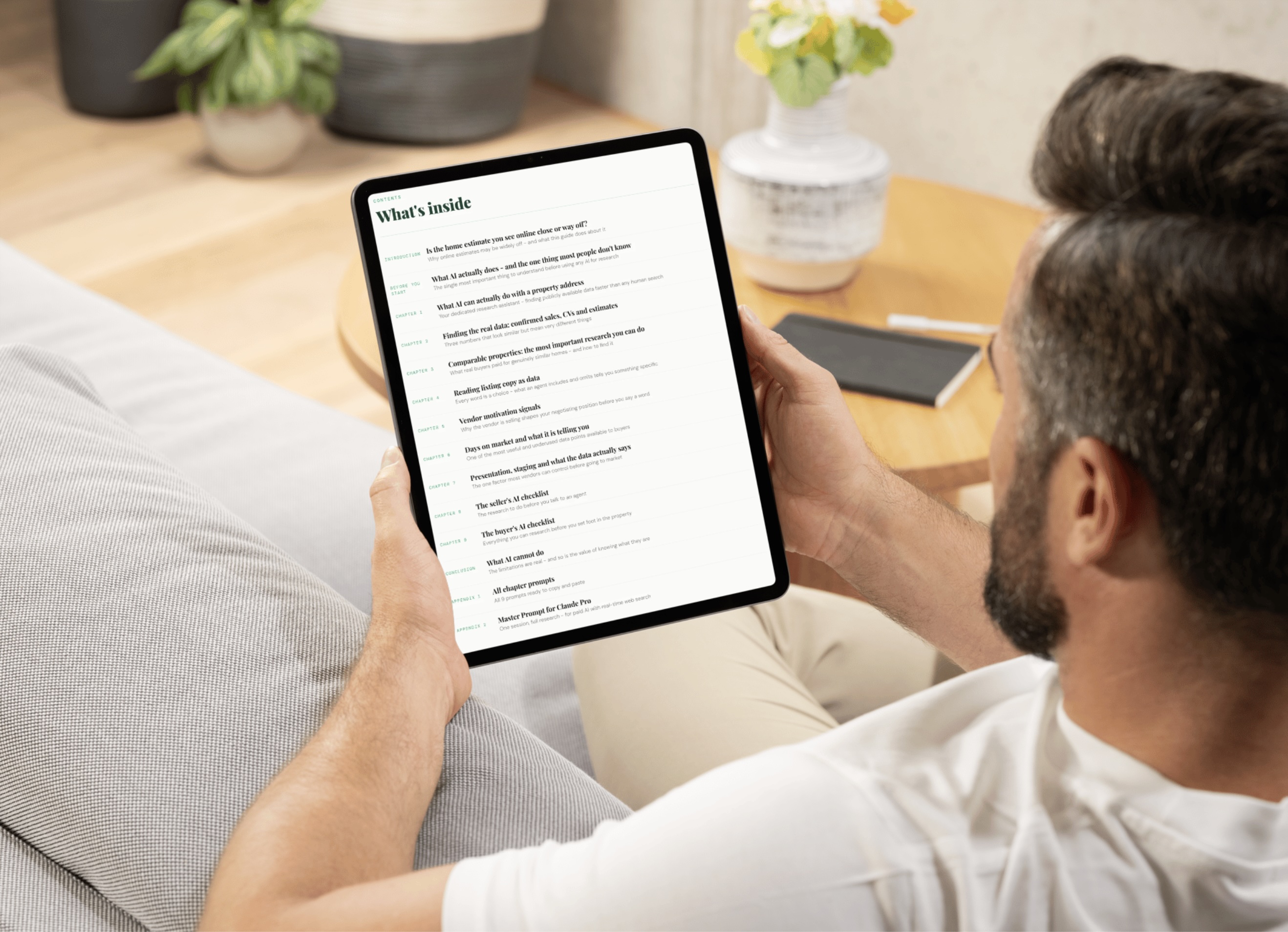 A person reading the HomeValueAI guide on an iPad showing the table of contents